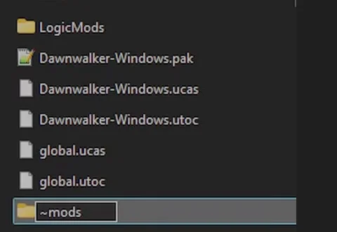 A Windows folder listing showing a LogicMods folder, the game's Dawnwalker-Windows pak, ucas and utoc files, global.ucas and global.utoc, and a new folder being named ~mods